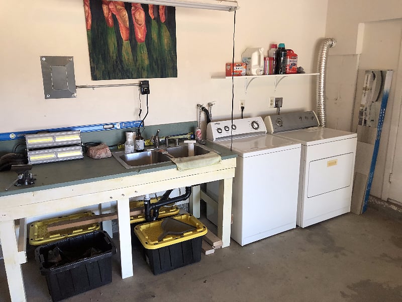 Laundry setup, workbench with sink if needed.
