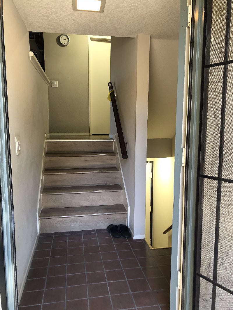 From Front Door: Up 5 steps to living area, down to the garage/laundry.