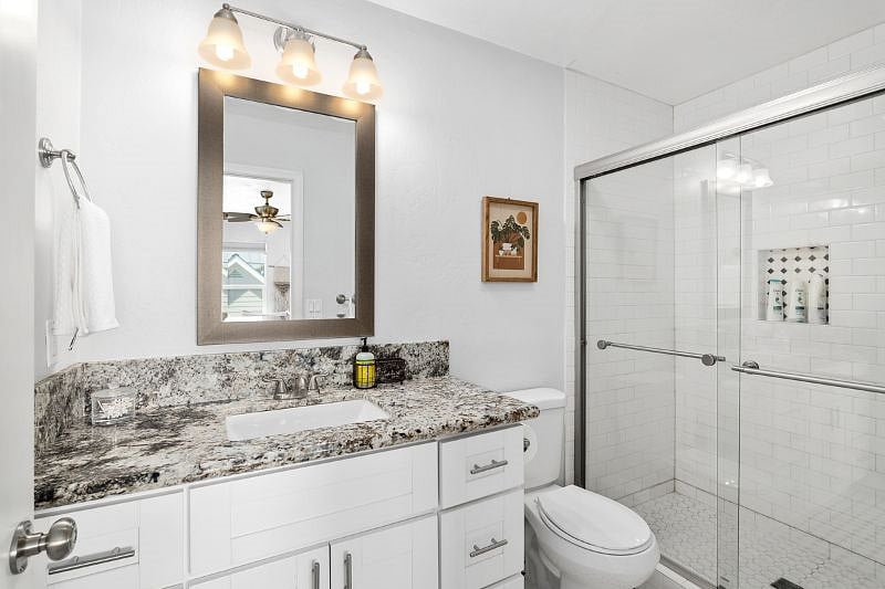 En suite bathroom (3/4) to Bedroom 1.