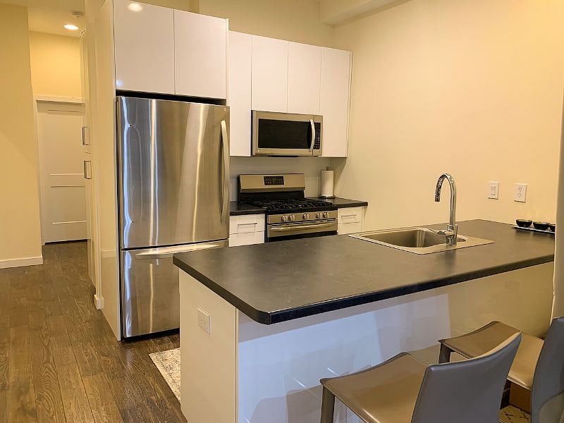 Full sized kitchen with stainless steel appliances