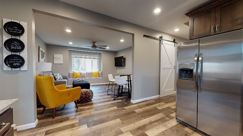 The kitchen flows into the living room, featuring a Smart TV. Bring your favorite streaming service!