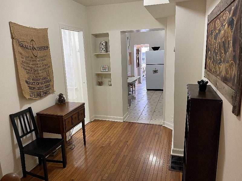 Upstairs just behind, to the left. Moving forward is the 1/2 bath, kitchen, laundry room, and outdoor deck/yard.