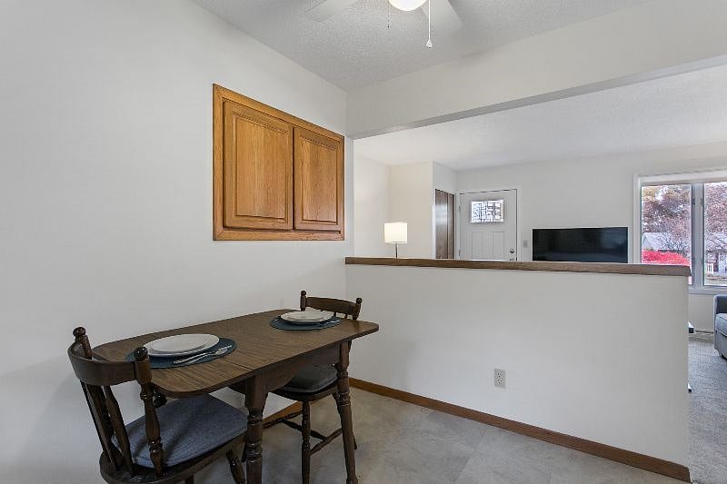 Dining area table seats 4 with additional chairs stored in the basement

