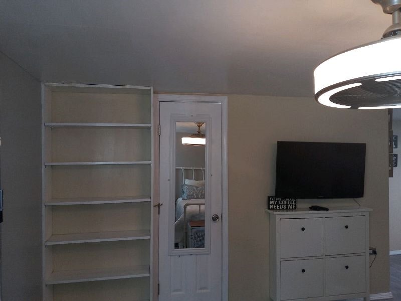 Smart TV with Sling & internet. Shelves for shoes and storage.