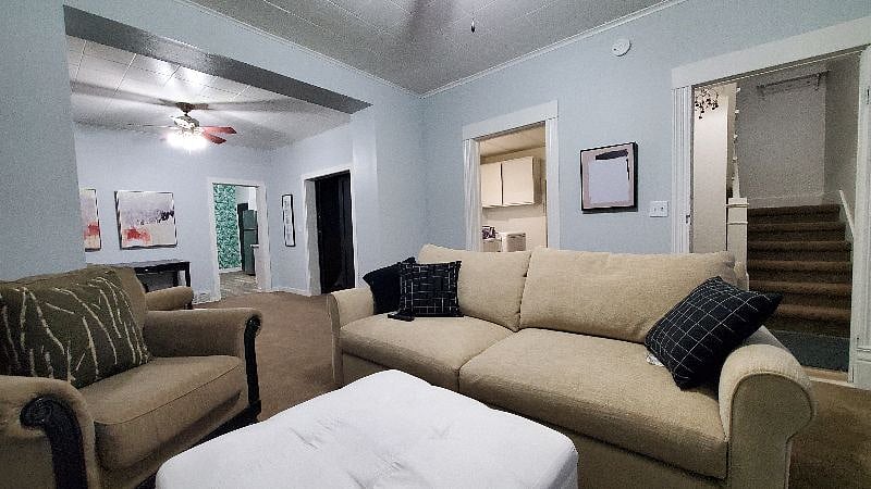 Here's the shared living-room with comfy seating and a TV that you may use for streaming.