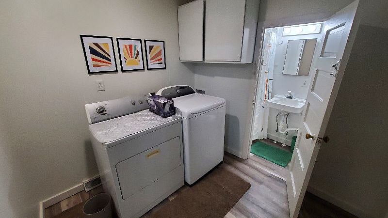 Laundry is free, not in a dungeon, and the light comes on with a motion sensor. You won't drop your laundry. ;) There's an iron and ironing mat on the dryer to use.