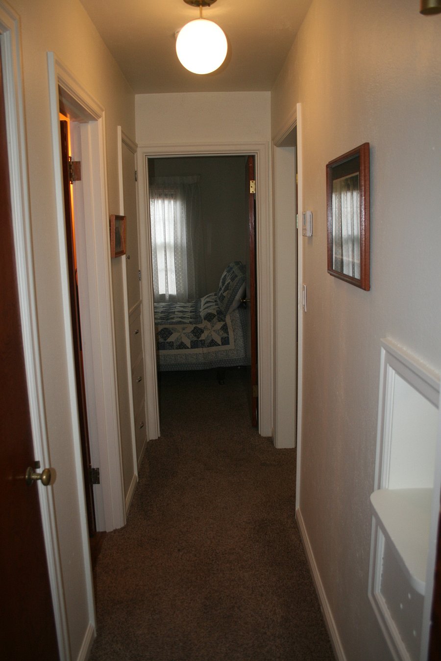 Hallway into Bedroom 1 (queen bed)