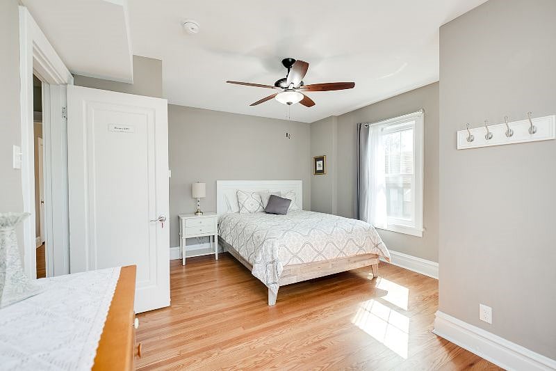Bedroom #203 with Queen size bed, dresser and closet.