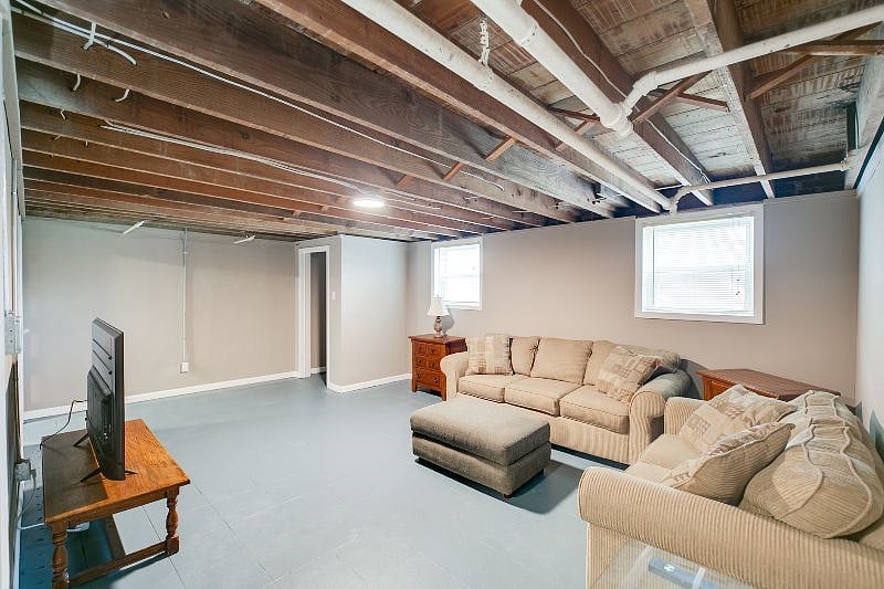 Lower level partially finished with another great room and smart TV.