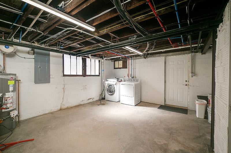 Laundry utility room with washer dryer.  Laundry soap is provided.