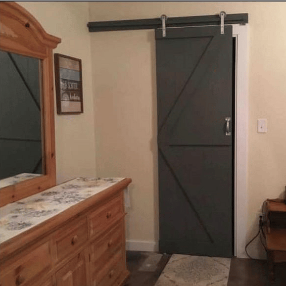 Farm door leading to walk-in closet