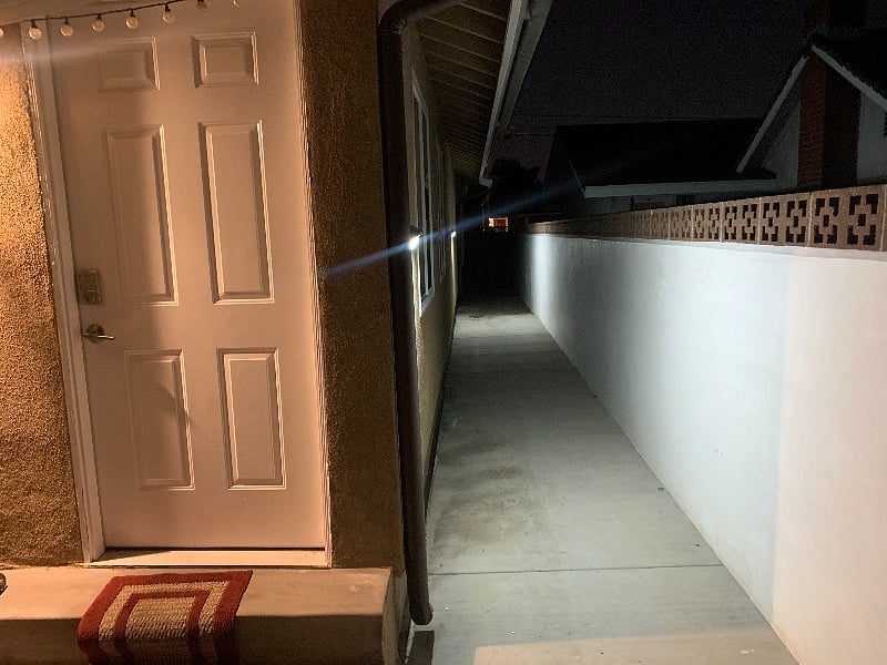 Very well lit walk way to front door. 
