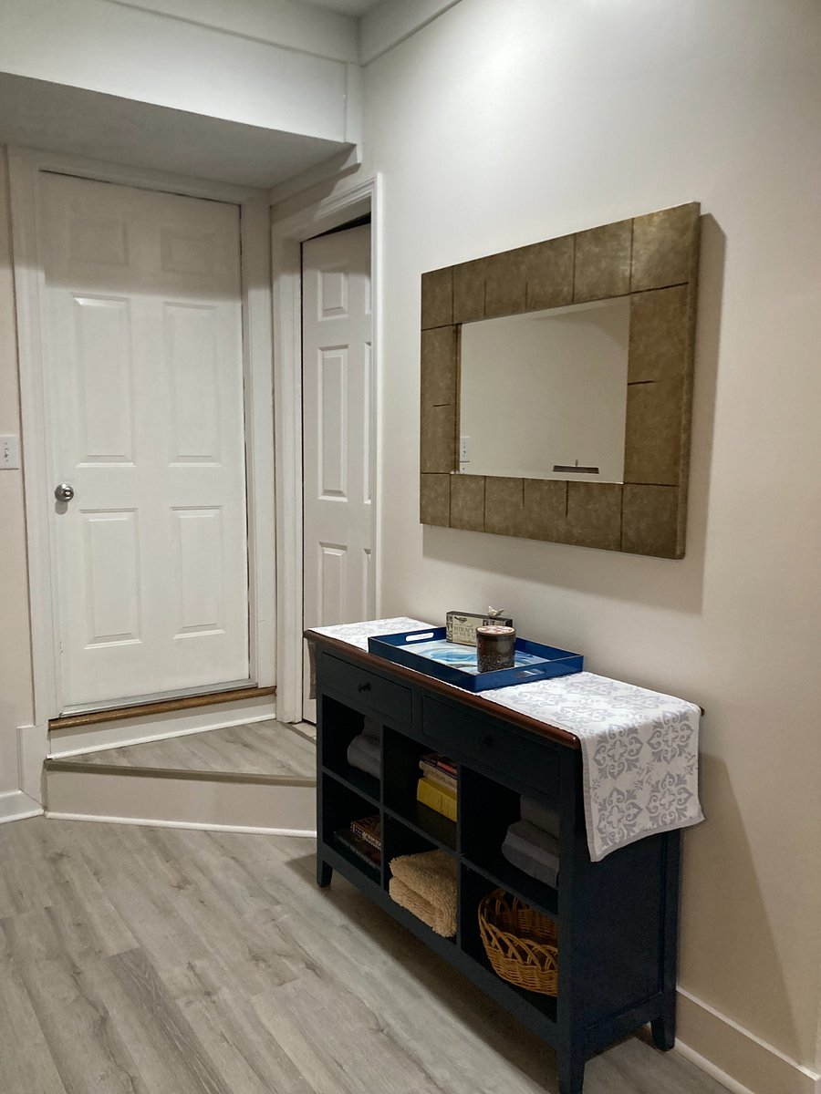 Sideboard table for additional storage of linens, towels, kitchen items.