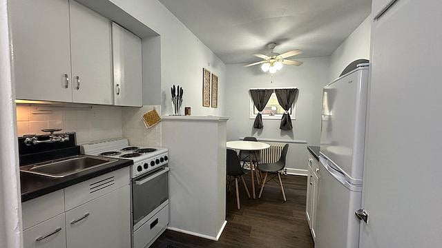 Renovated kitchen with newer refrigerator, stove/oven, newer cabinets, newer bowls/plates, pots, utensils, microwave, kitchen chairs/table, toaster oven, coffee maker, airfryer, rice cooker, blender, water filter, and more.