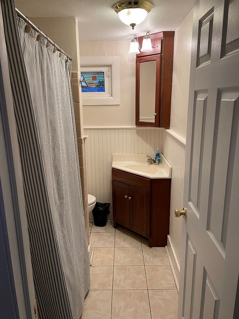 Second floor bathroom with tub and shower.