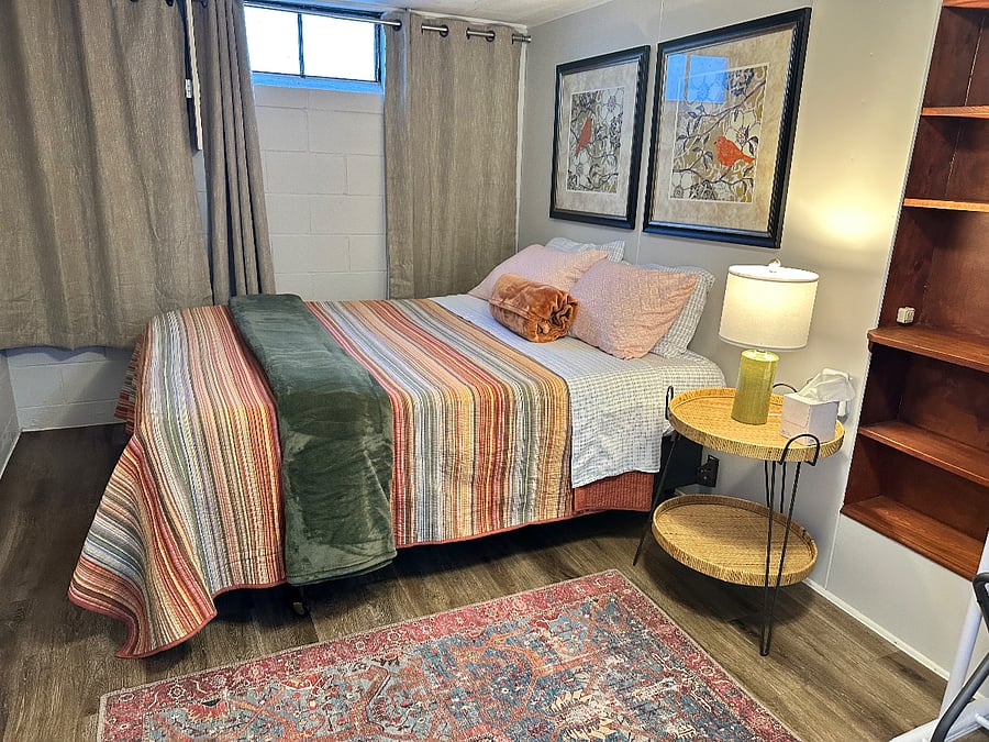 Lower level off of the garage. Very close to laundry room/ and 2nd toilet. Queen size!