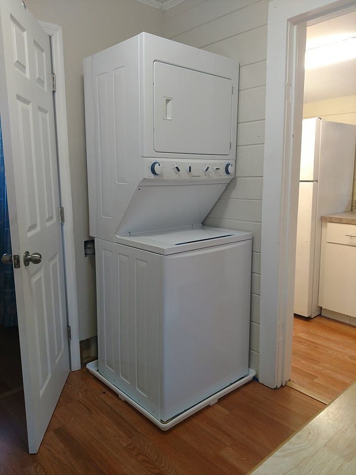 Full sized stacked washer and dryer.