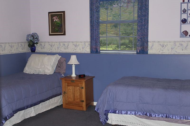 Asian room with two twin beds and one queen bed