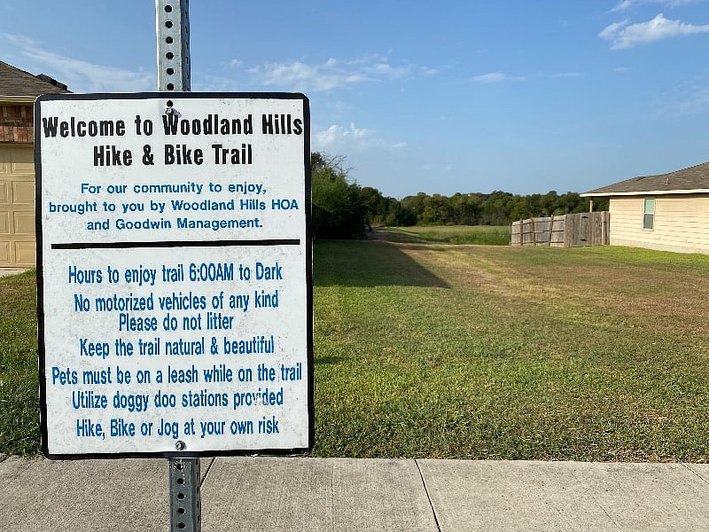 Hike & bike trail, ~1-mile loop, through beautiful wooded area with ponds and bridges. 