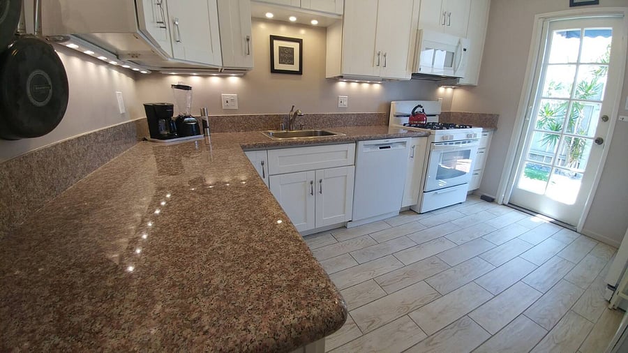 Your dream kitchen with granite countertops, full size appliances, and glass door to your back yard!