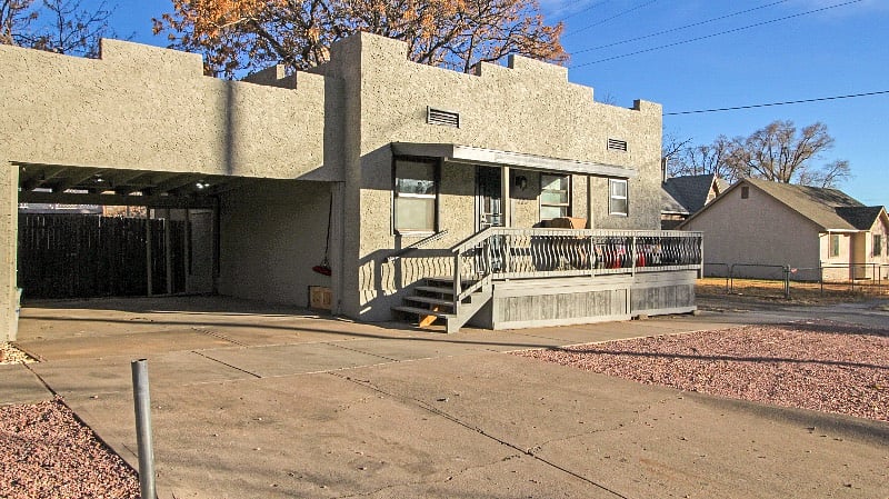 Front of unit with carport space for 1 car to left of cottage, parking also available on the gravel area in front of cottage.