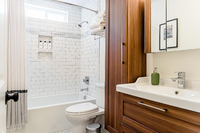 downstairs full bathroom with linen closet