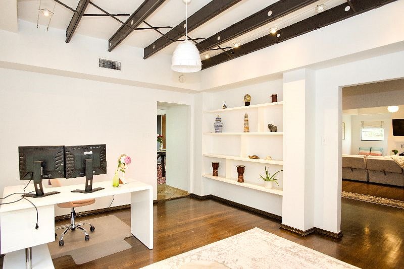 Office equipped with dual monitors and optional kid's desk.