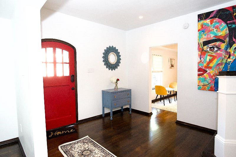 Foyer with beautiful colors and newly stained hardwood floors.