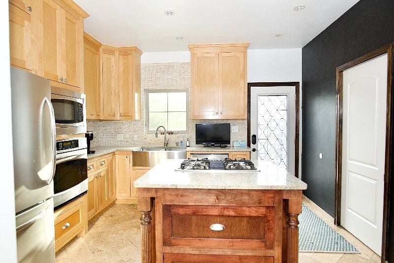 Fully stocked kitchen with GE Profile appliances.