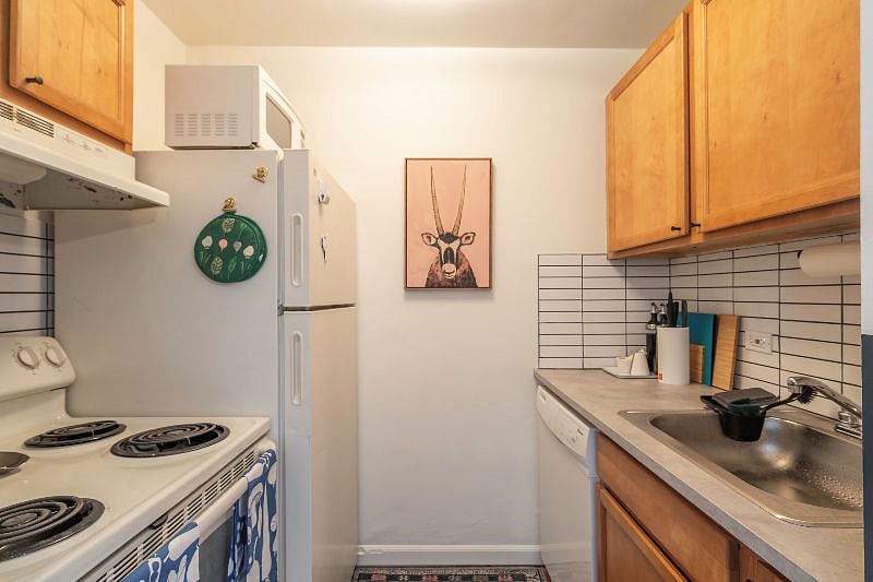 Kitchen with full size refrigerator, dishwasher, cooktop and oven. Instant Pot in cupboard, along with all cooking and eating utensils.