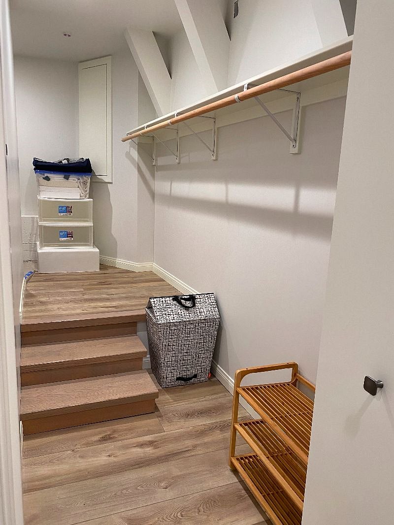 Large walk in closet leads to washer/dryer and lots of extra storage space.