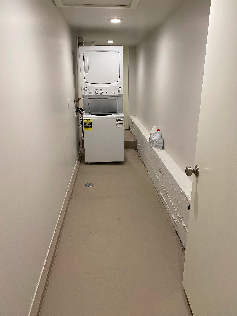 Full size washer/dryer included with unit. Lots of storage in this long, walk in hallway space.