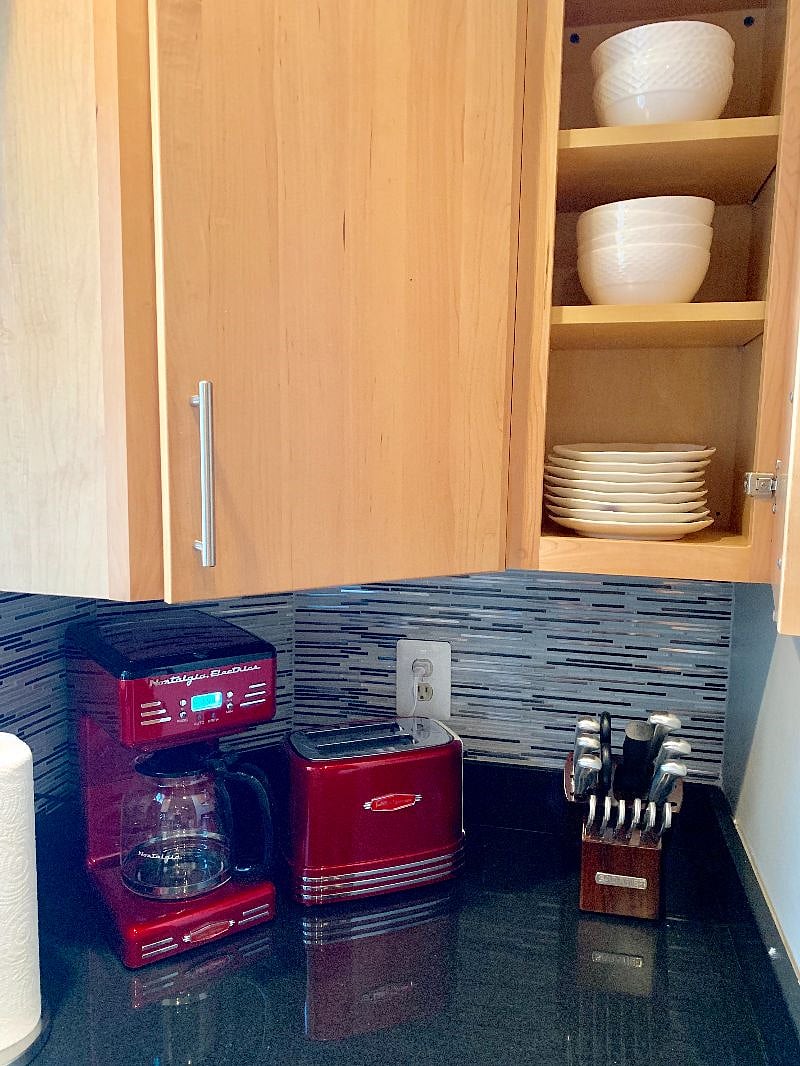 Fully stocked kitchen with a coffee maker, water kettle, and a toaster