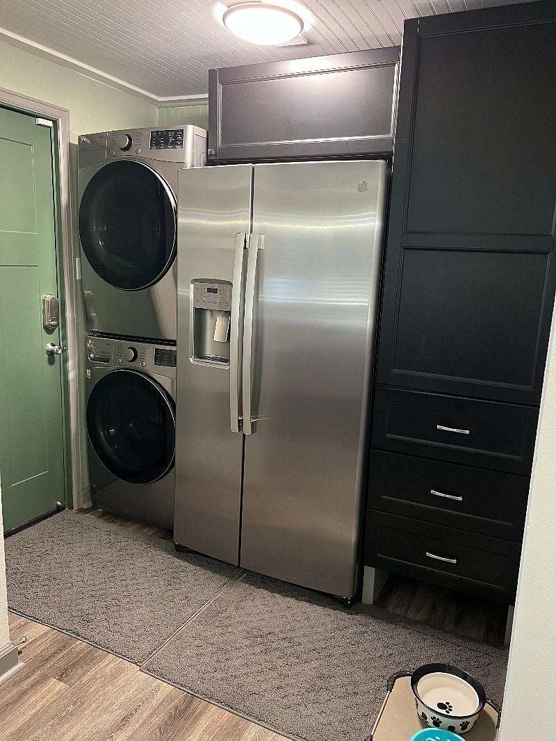 Fridge and freezer with water/ice in door.