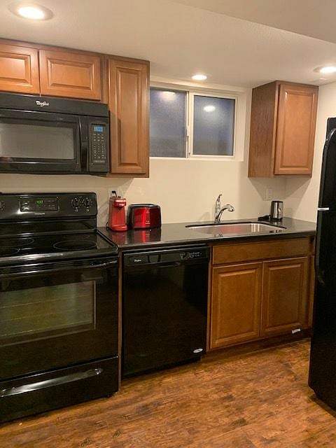 Electric glass top stove, dishwasher, full size refrigerator and granite countertops.