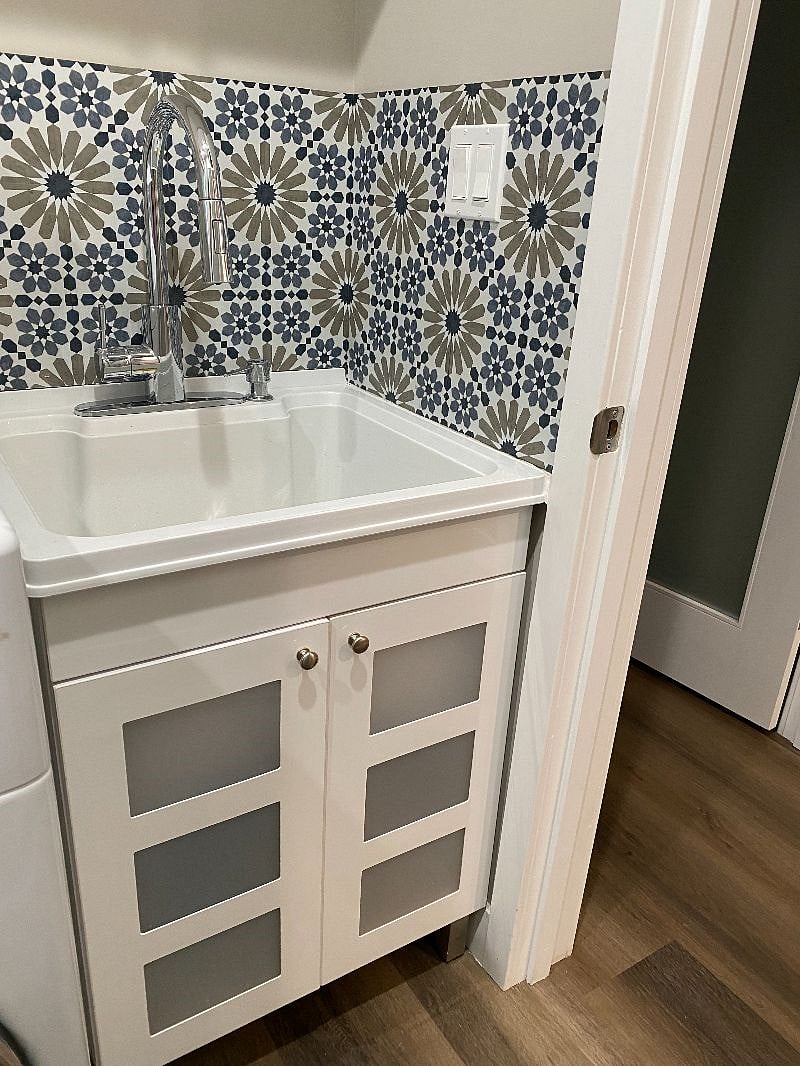 20" deep utility sink in the laundry room.