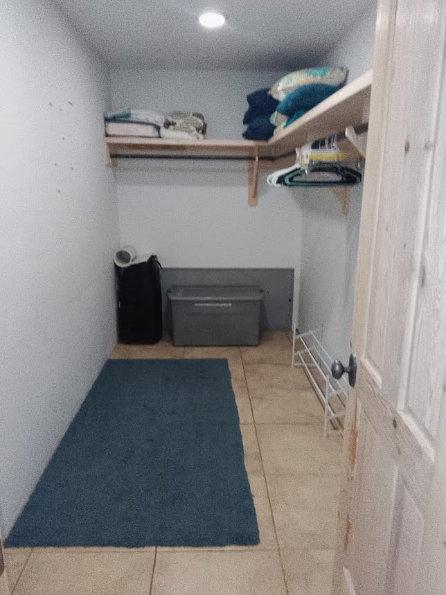 Large walk in closet with additional supplies, linens, cooling etc.