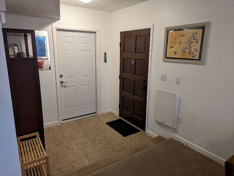 Entrance with keypad automatic locking door for safety along with Ring Doorbell camera at the front of the house for security.