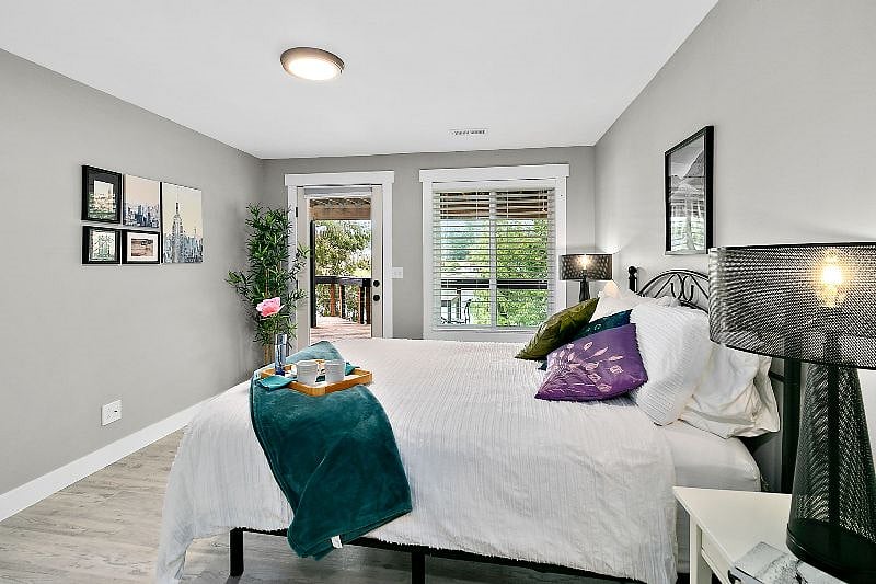 Bedroom with door opening to the private deck