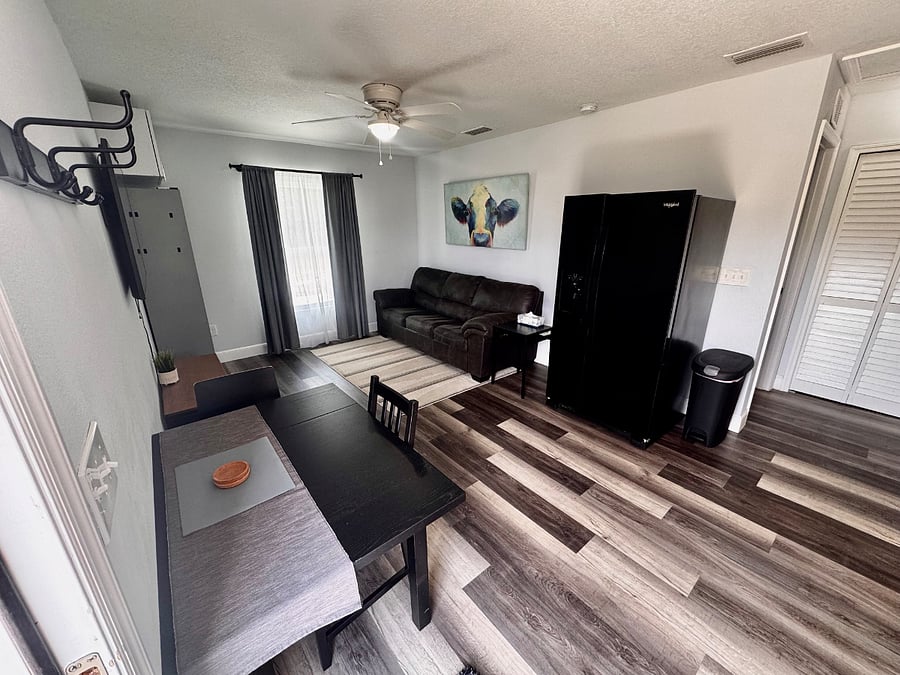 The apartment features bright, cheerful lighting throughout, creating a warm and inviting atmosphere from the moment you enter. A full-size refrigerator is located next to the kitchen and includes a Brita pitcher, which can be filled with clean well water from the propertyfree from fluoride and other harmful chemicals. In the freezer, youll find ice cube trays along with an ice storage bin for your convenience.