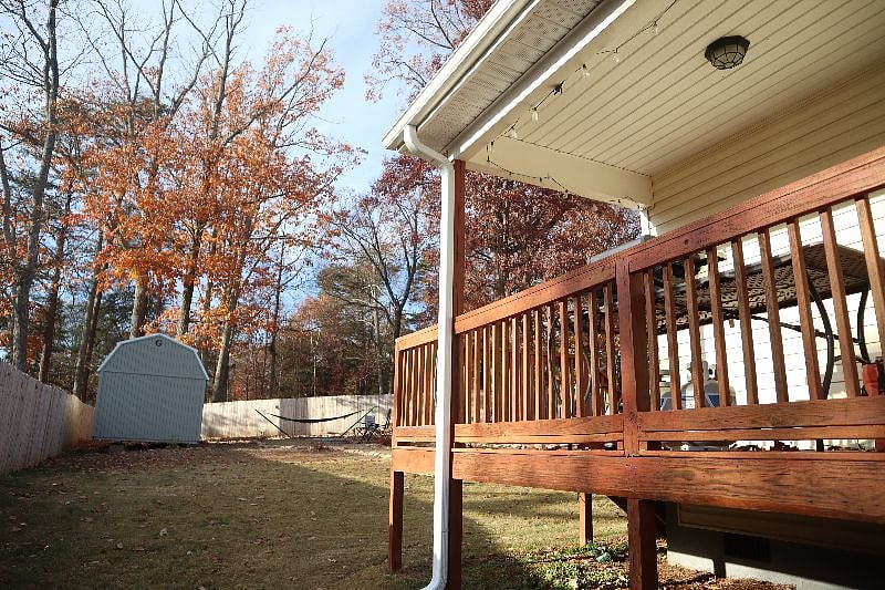 Back porch perfect for reading a book or watching the birds!