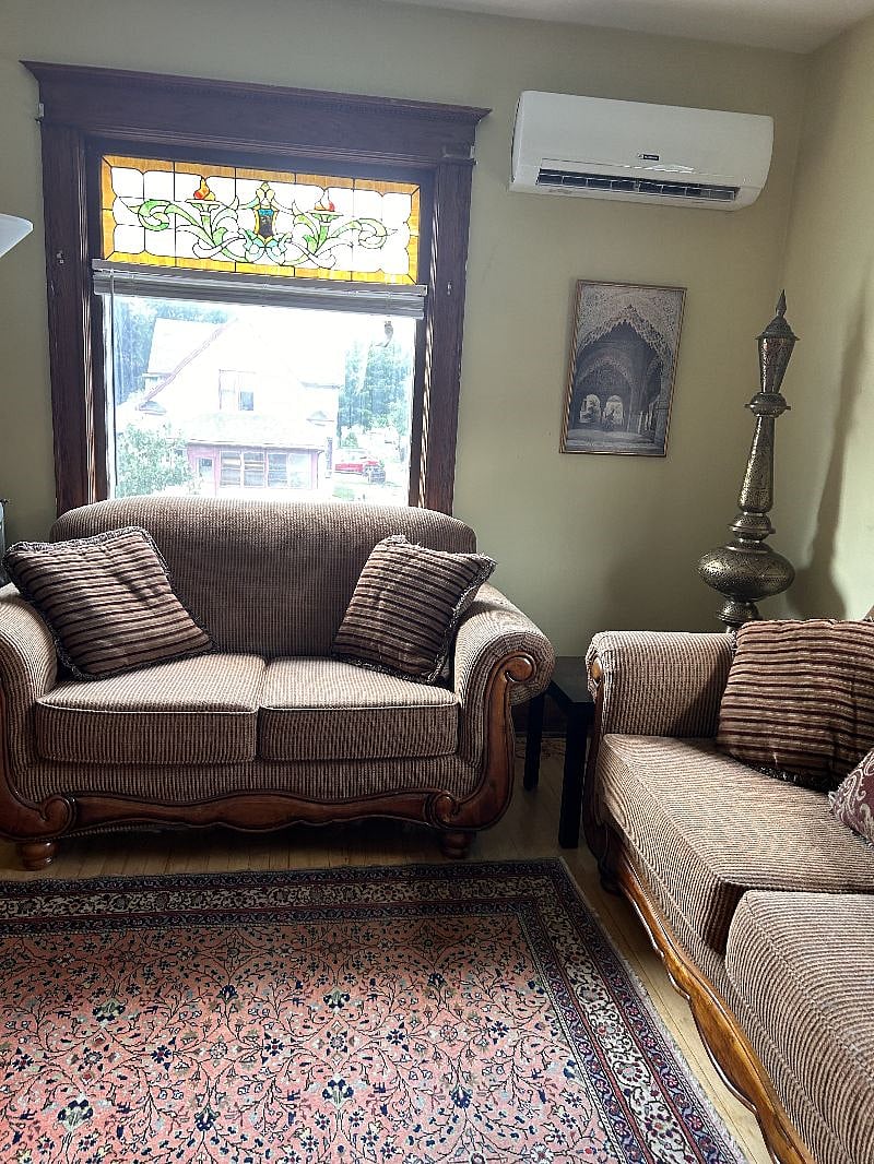 Cozy living room with stained glass windows.