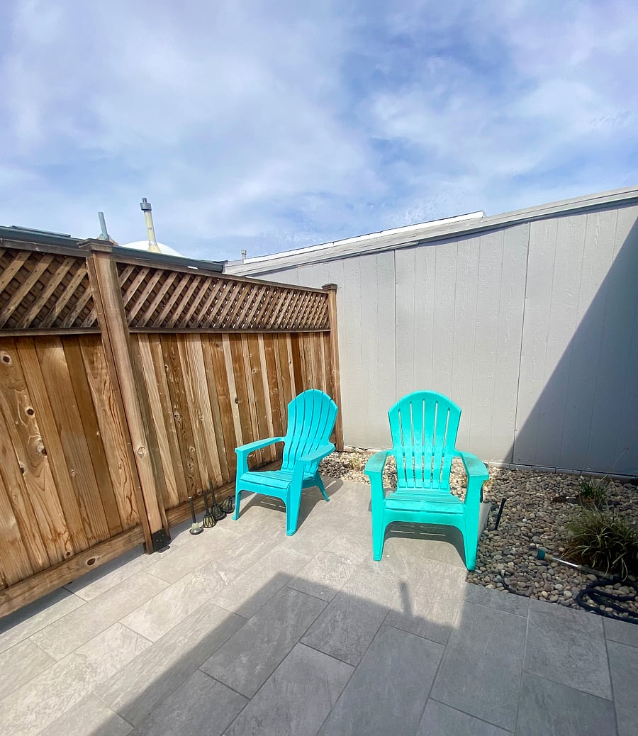 Patio with Adirondack chairs.