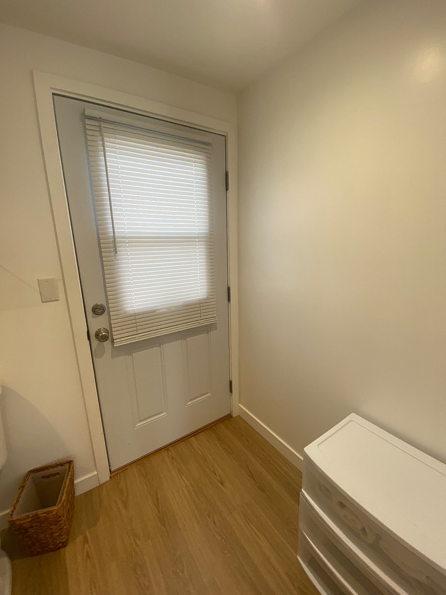 There are two ways to enter the Studio. This door opens to the walkway  entrance, it is accessible as you exit the bathroom.