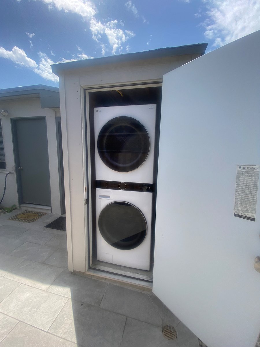 Washer & Dryer located in a cabinet on patio. Also in the photo is the entrance door to Studio. 
