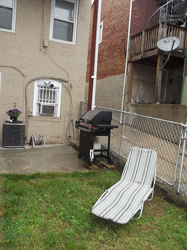 The studio has a back yard patio and new outside gas grill.