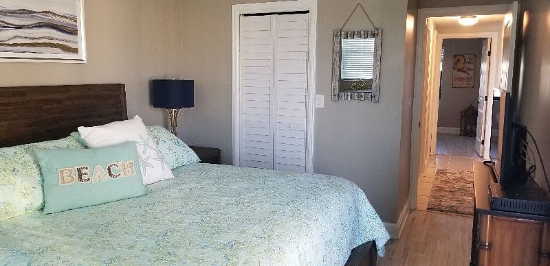 Super comfy king bed in large bedroom with walk in closet.  A large dresser and 2 nightstands.  