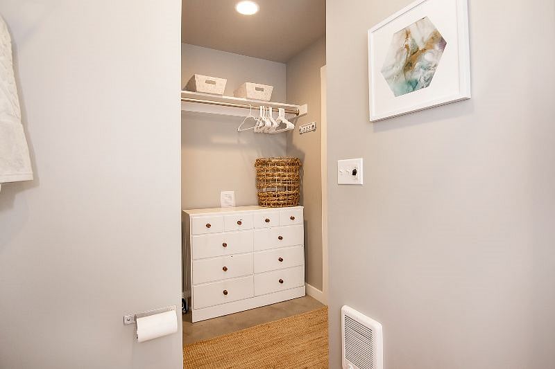 closet (in the bathroom). we recently added a stackable laundry unit (washer/dryer) in this closet that is not pictured.