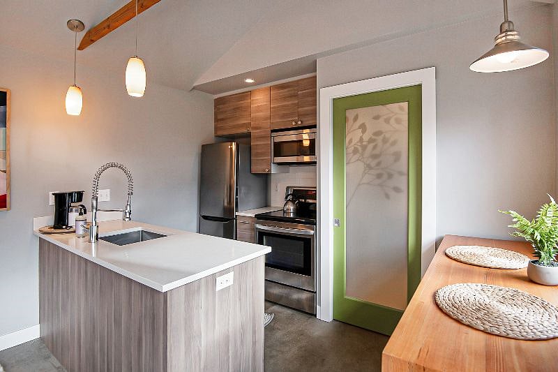Full kitchen with full sized appliances including dishwasher