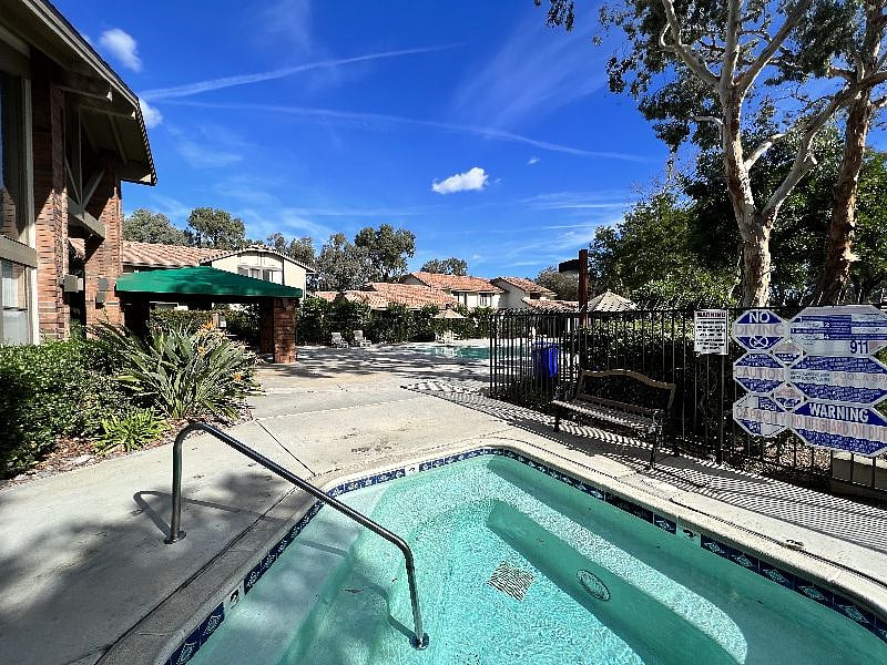 Hottub and pool are both close to the home.